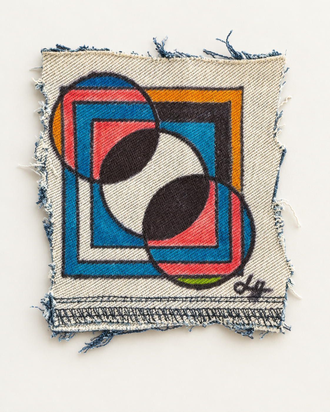 Overlapping circles and nested rectangles in blue, coral, black and yellow on frayed denim.